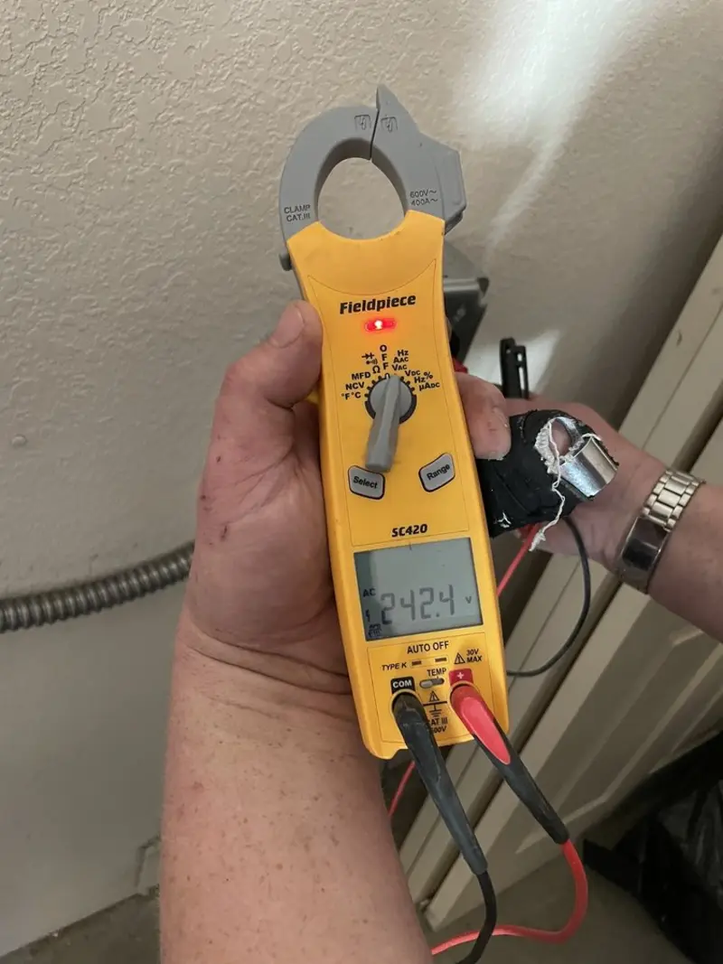 Voltage testing with clamp meter during Outlet Installation in Conyers